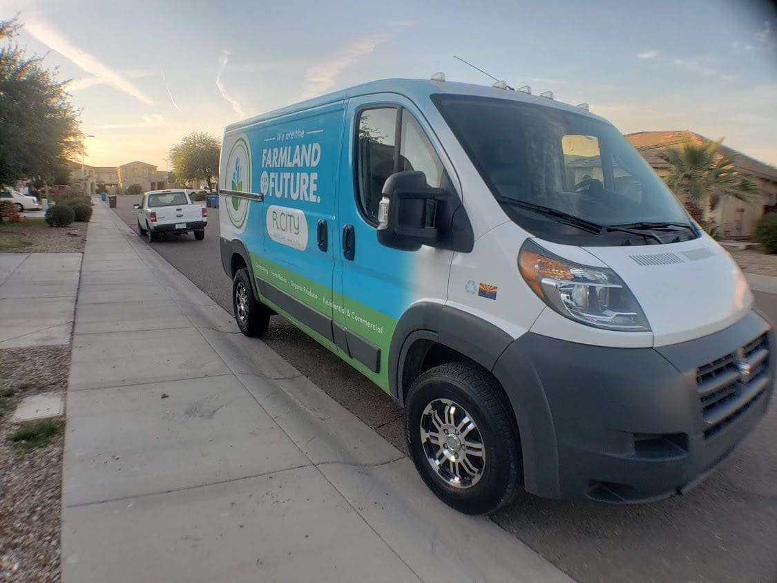 A van is parked on the side of the road.